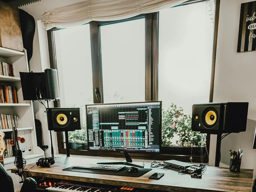 My desk during production, listening and fixing as I go